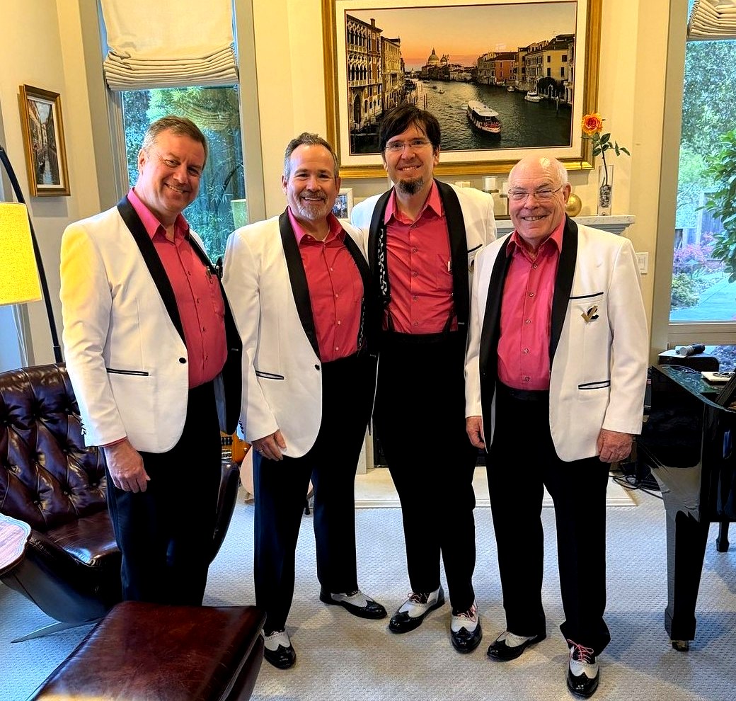 Vocal Capital in formal attire indoors